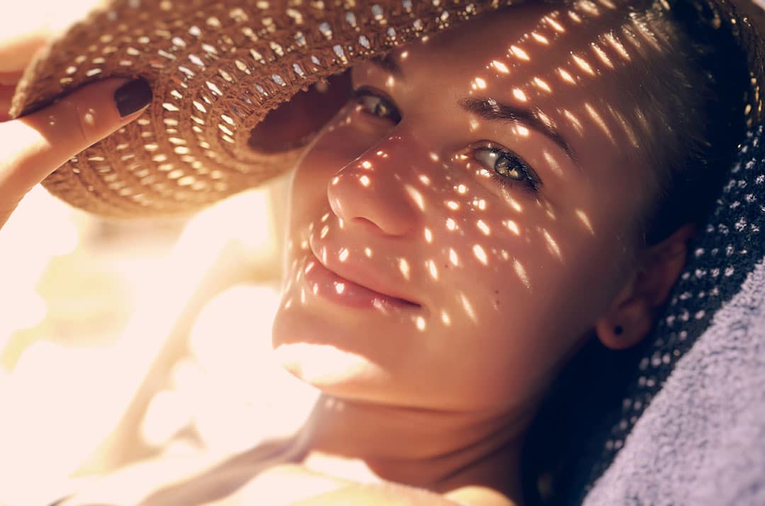 Woman under a sun hat