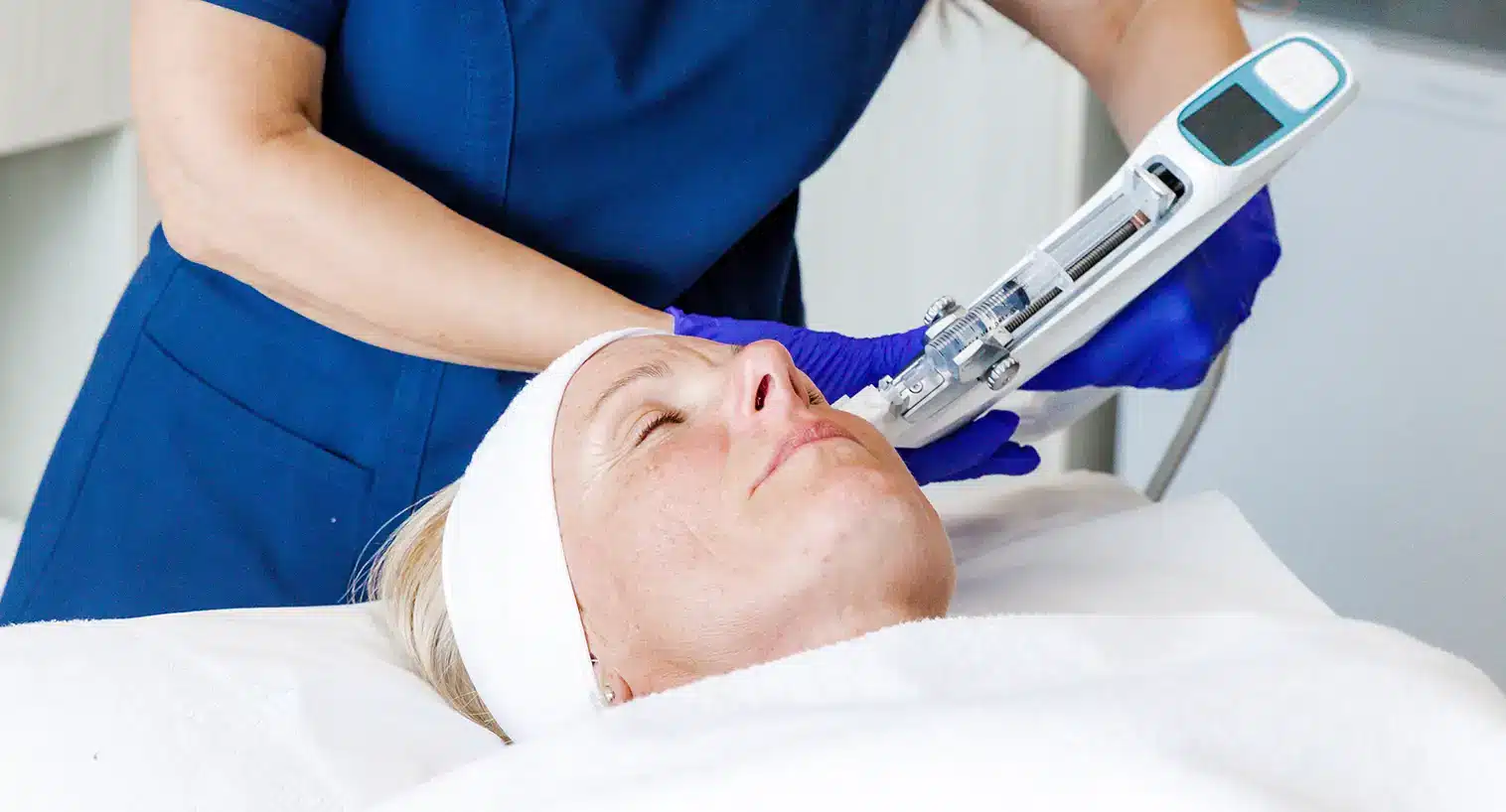 Patient receiving a SkinBooster treatment on her face