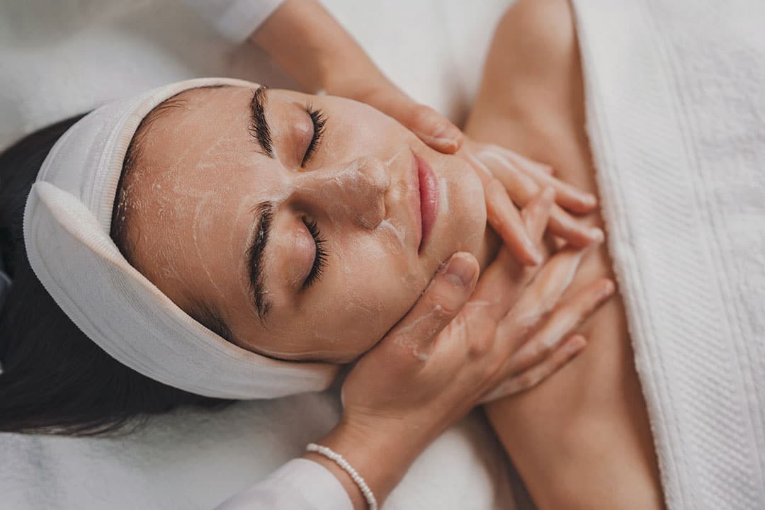 Woman receiving a facial treatment