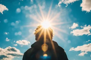 Silhouette of a man standing in the sun