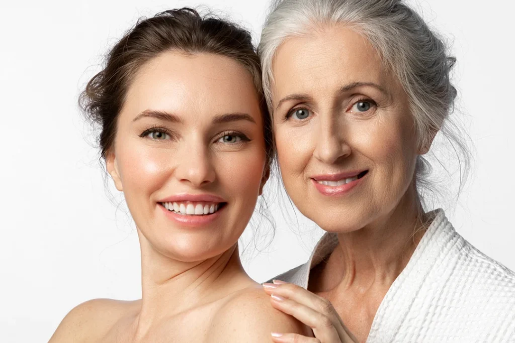 Mother and daughter smiling
