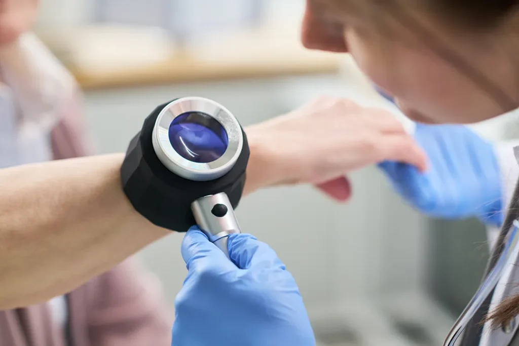 Patient being checked for skin cancer and sun damage